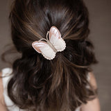 Donsje qalja clip vlinder, clay metallic leather